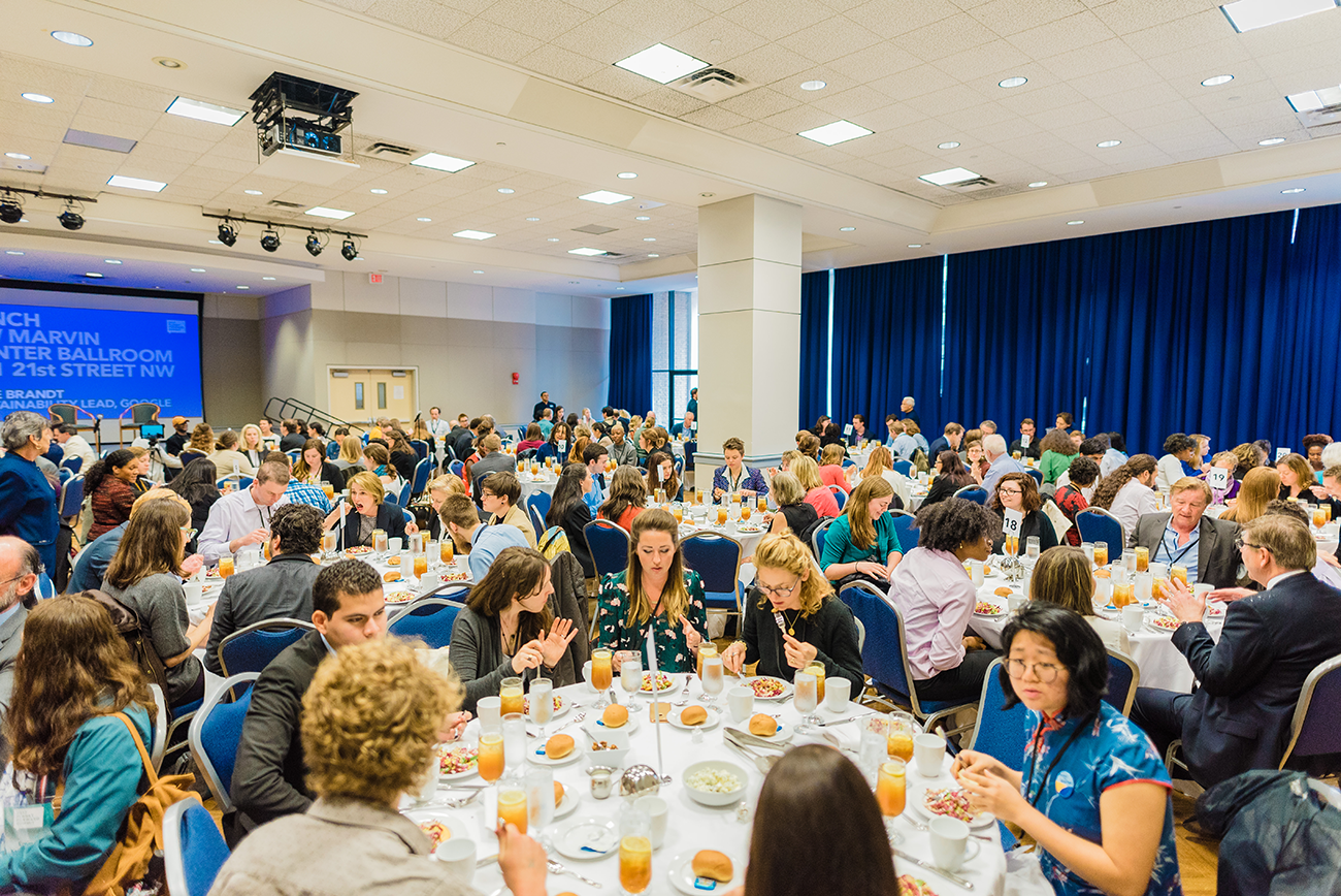 Attendees network at lunch in GW&#039;s Marvin Center.